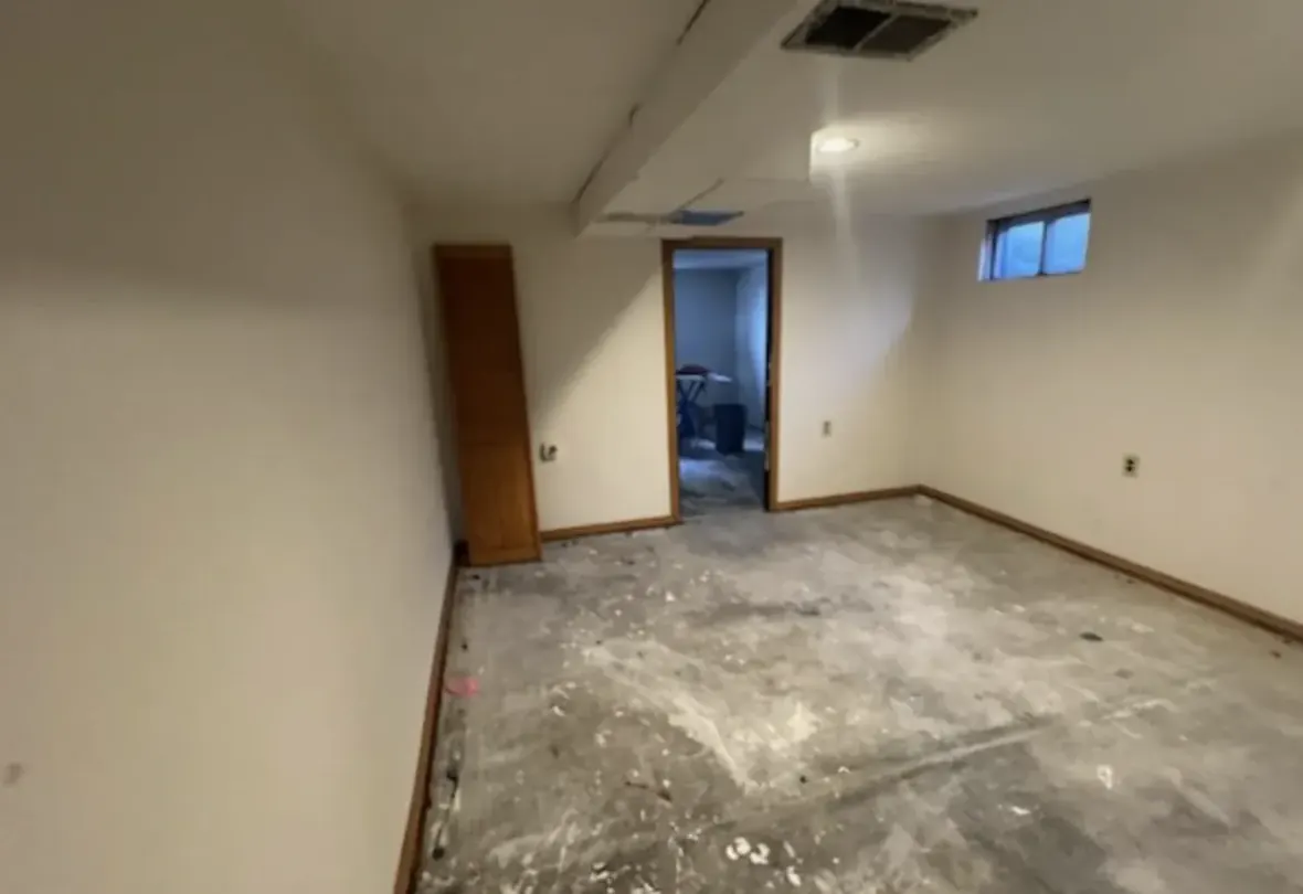 Basement of an Arvada, Colorado house bought as-is by Windcrest Investments, before
