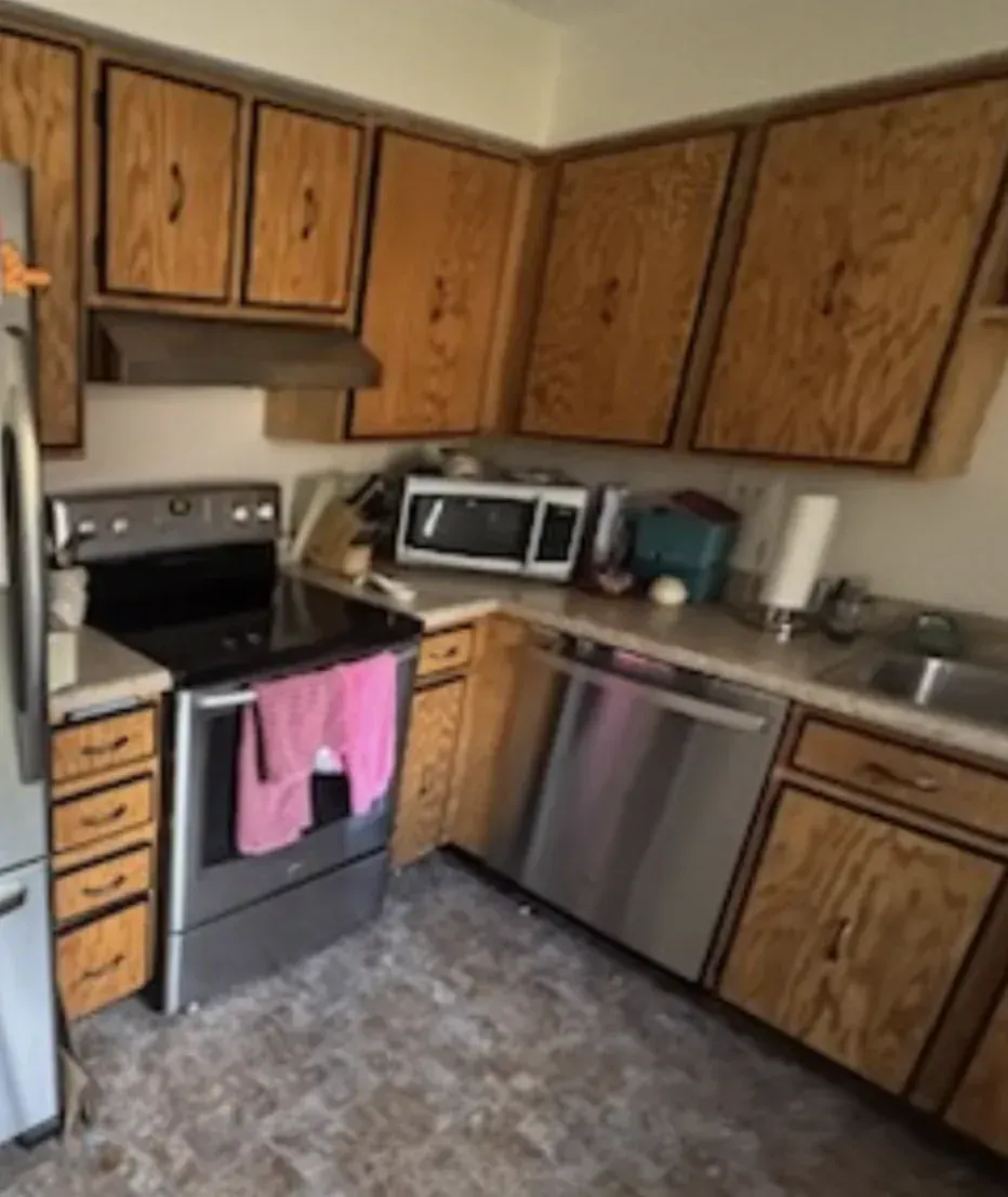 Kitchen of an Arvada, Colorado house bought as-is by Windcrest Investments, before