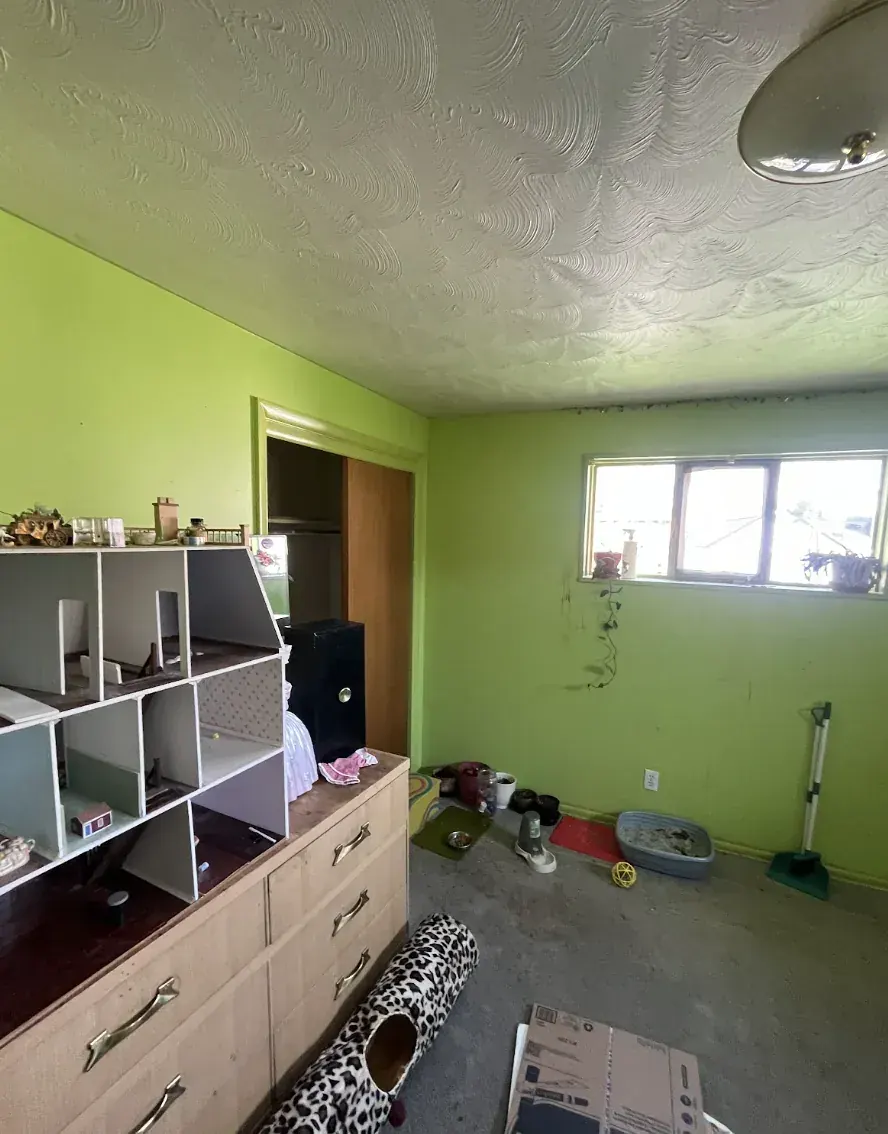 Bedroom of a Broomfield, Colorado house bought as-is by Windcrest Investments, before