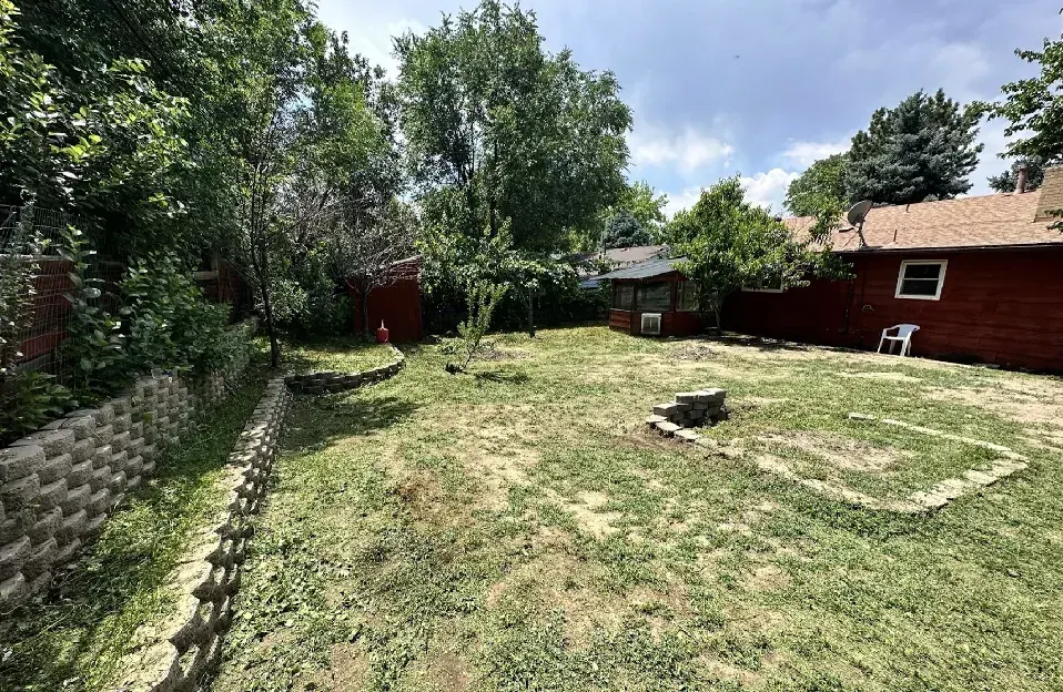 Backyard of a Westminster, Colorado house bought as-is by Windcrest Investments, before