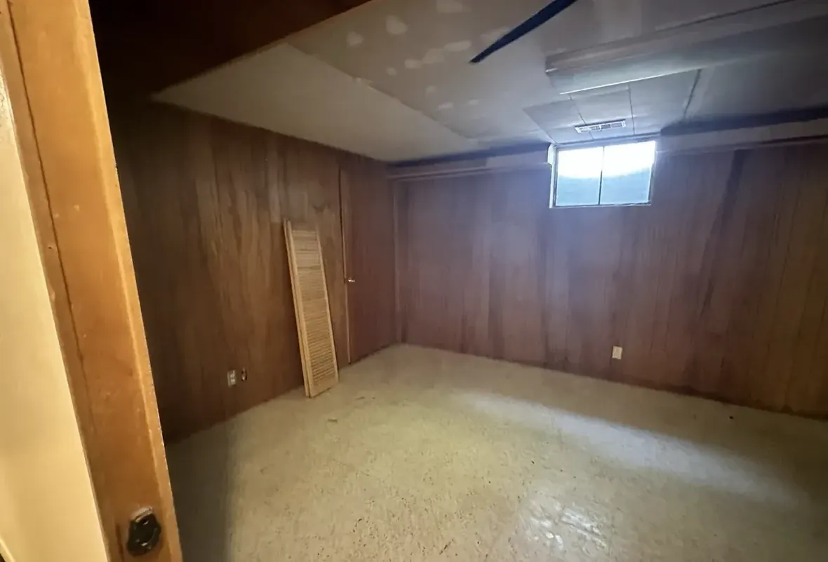 Basement of a Westminster, Colorado house bought as-is by Windcrest Investments, before