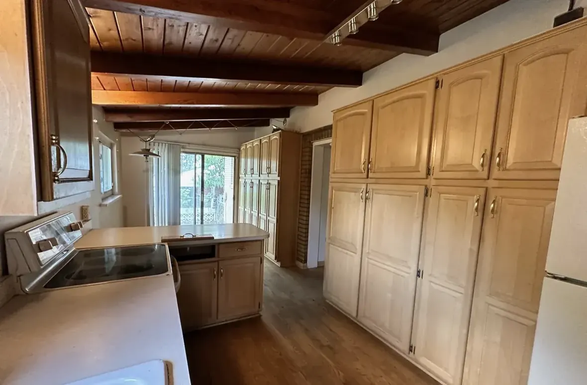 Kitchen of a Westminster, Colorado house bought as-is by Windcrest Investments, before